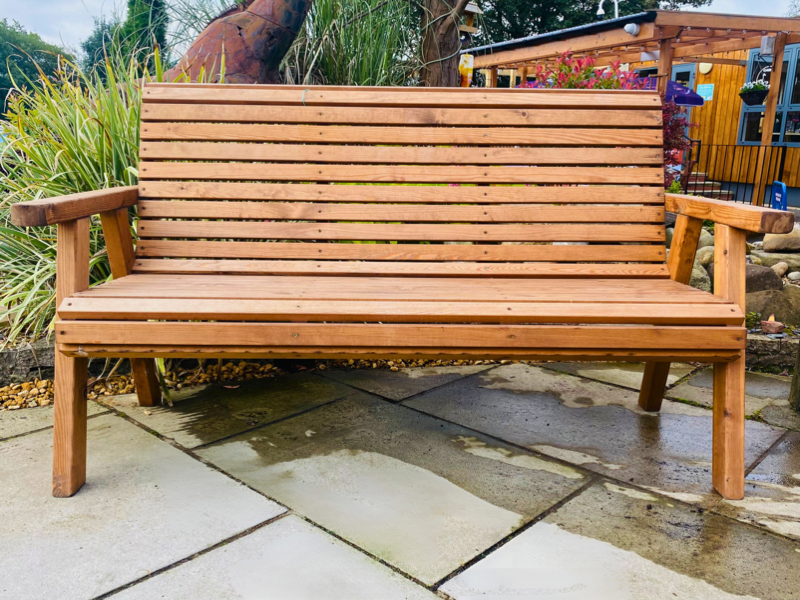 A hardwood bench fit for three people.